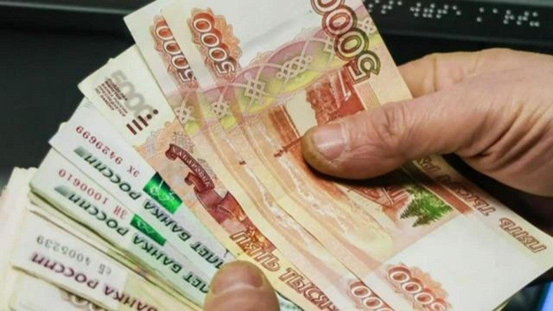 Russian Rouble slips back towards record lows in volatile trade