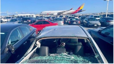 United Airlines Jet Loses Wheel, Damages Car Parked Below
