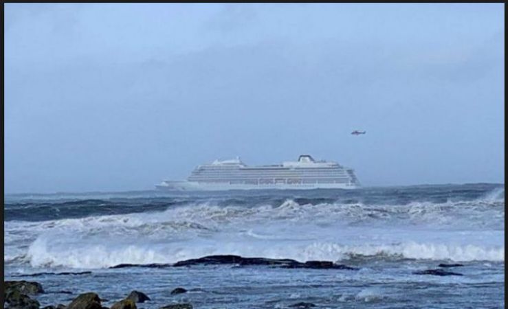 Helicopter rescue evacuating people from a cruise in stormy weather in Norway