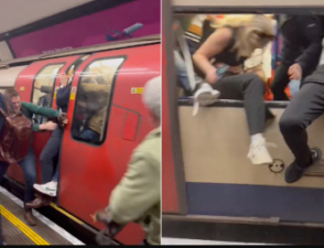 A fire alert forces passengers to force their way out of a London Underground train