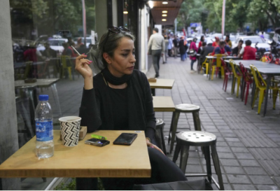 Iran's government pushes back as more women choose not to wear the hijab