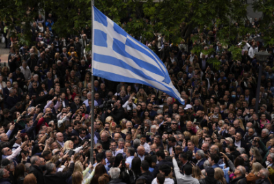 Greeks are experiencing election-day recovery pains while escaping the bailout spotlight