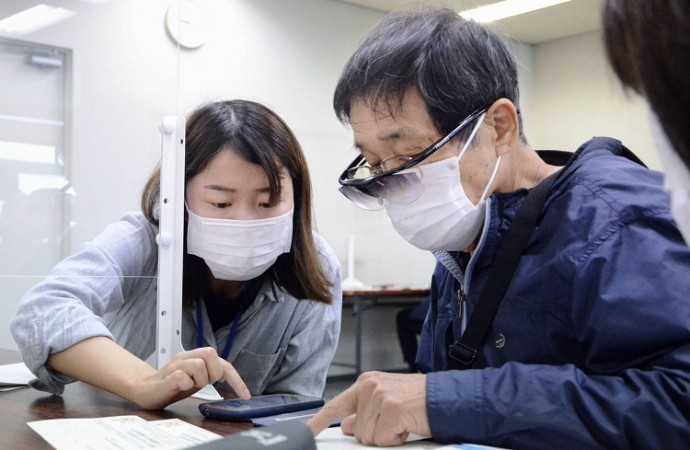 Japan: Virus emergency set to widen, approves more COVID-19 vaccines