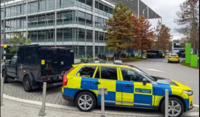 Armed police are stationed to protect a Persian-language TV station in London