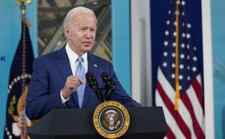 Biden signs legislation to raise the US debt ceiling, averting default.