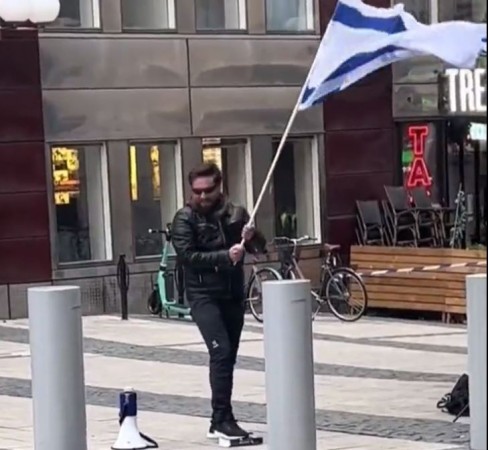 Viral Video Captures Controversial Act of Stepping on Quran and Waving Israeli Flag