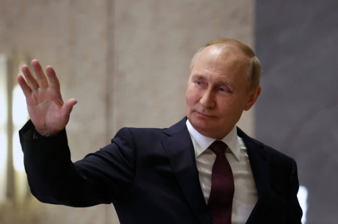 Vladimir Putin grins as he cautions Ukraine that the conflict could become more serious