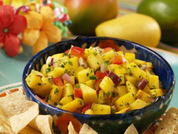 Serve mango salsa with chips and wafers