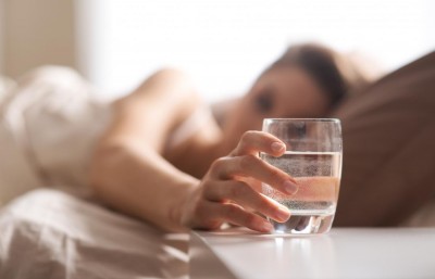 Can drinking water immediately before sleeping cause harm?