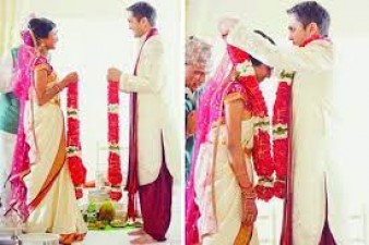 Why do bride and groom garland each other in marriage?