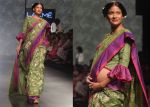 Carol Gracias walks the ramp with baby bump