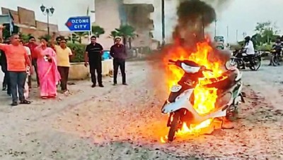 Demonstration of people due to non-construction of road, scooty parked in the middle of the road and set fire