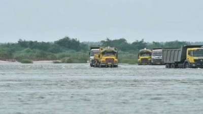 132 trucks and several JCB trapped in floods within Krishna river, situation critical