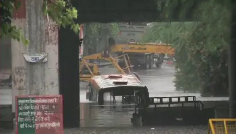 Delhi: Rain wreaks havoc, Bus submerged in water