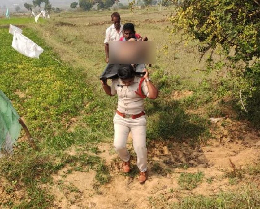 Woman Sub-Inspector carries unidentified  dead body after locals refuse to help