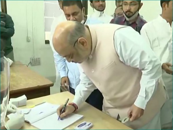 Gujarat: Home Minister Amit Shah arrives to cast vote with family