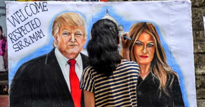 Students paint canvasses of US President Trump and his wife Melania to welcome the couple