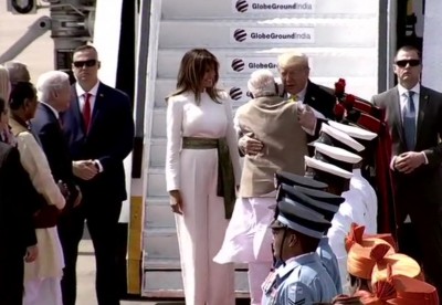 President Trump reaches Ahmedabad with family, PM Modi breaks protocol to welcome him