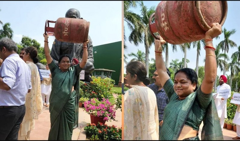 गैस सिलेंडर लेकर 'बाहुबली' मोड में महिला ने किया संसद के बाहर प्रदर्शन