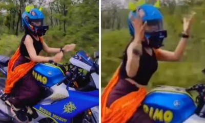 Stunt on a moving bike leaving both hands difficult for the girl, police took action