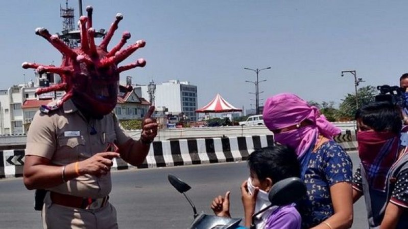 Chennai police spreading awareness wearing corona helmet