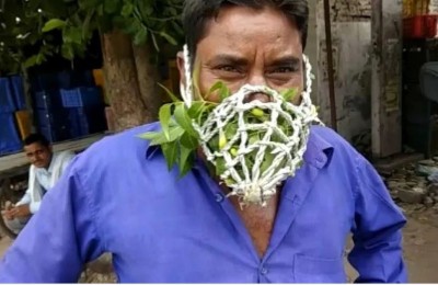 A picture of a young man wearing a neem mask going viral