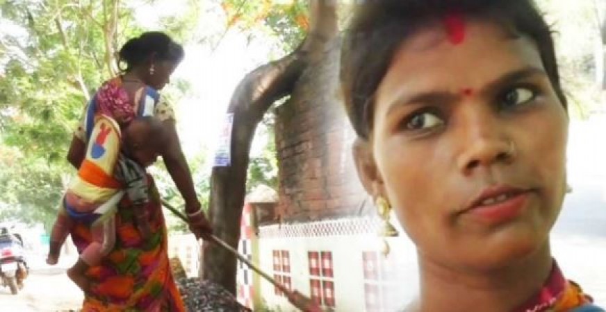 Lady sweeper Lakshmi Mukhi cleans road by tying the child to back