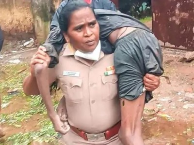 Hats off to the spirit of the woman officer!  carried the man on her shoulder to hospital,