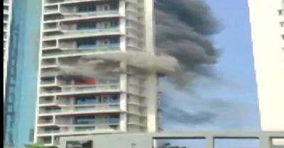 Fire broke out in 60-storey building, man hangs from balcony to save life