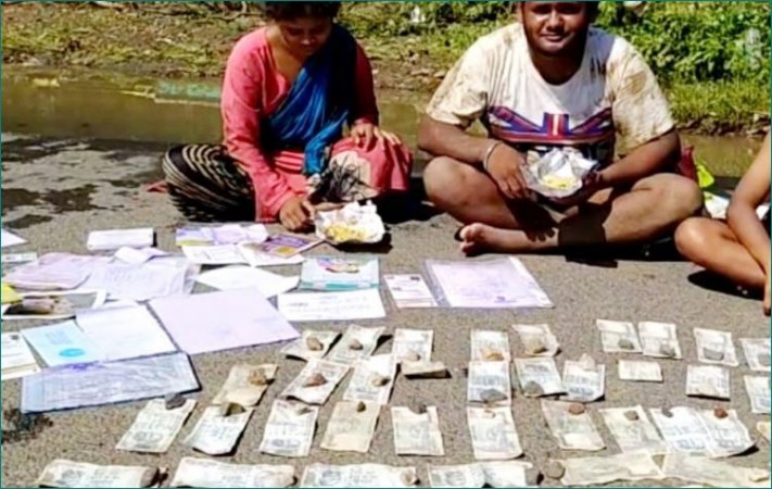 Family drying notes on road saved for daughter's marriage after recent floods in Maharashtra