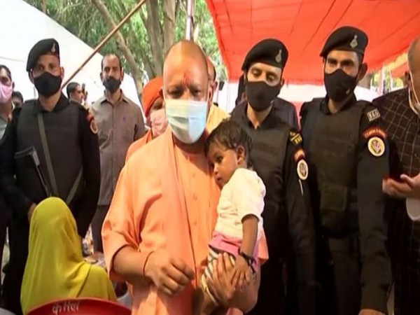 CM Yogi meets flood-affected people, distributed relief material