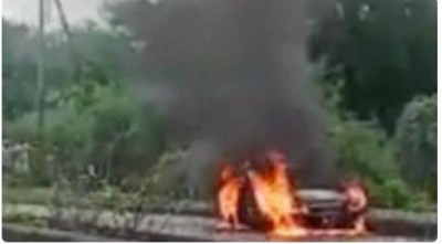 Man sitting in car with wife and son and set on fire