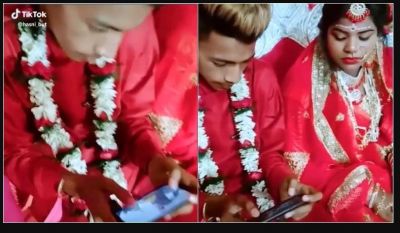 Viral Video! BrideGroom busy in playing PUBG in his own wedding