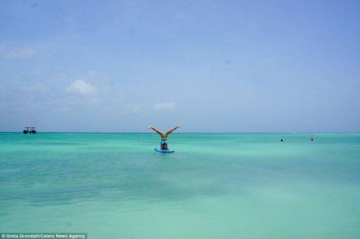 The girl performs Yoga at different famous places of the world