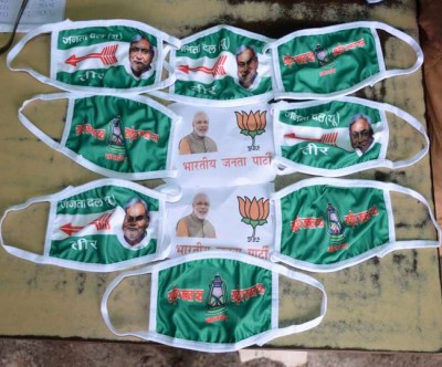 Masks with party symbols sold in market as part of election campaign