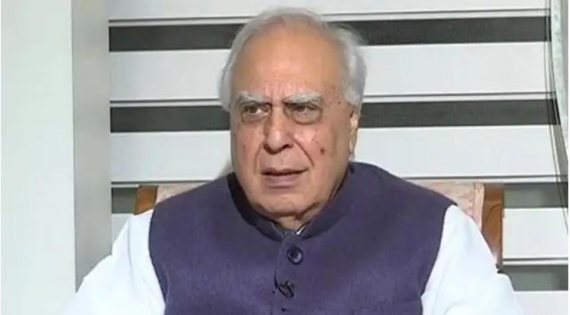 'It's just the beginning...', what is Kapil Sibal pointing to while riding a bicycle?