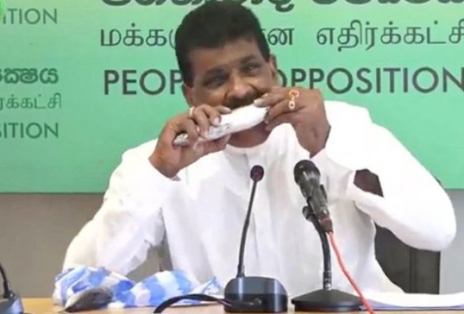 Minister eats raw fish in press conference to promote sales hit, Watch video