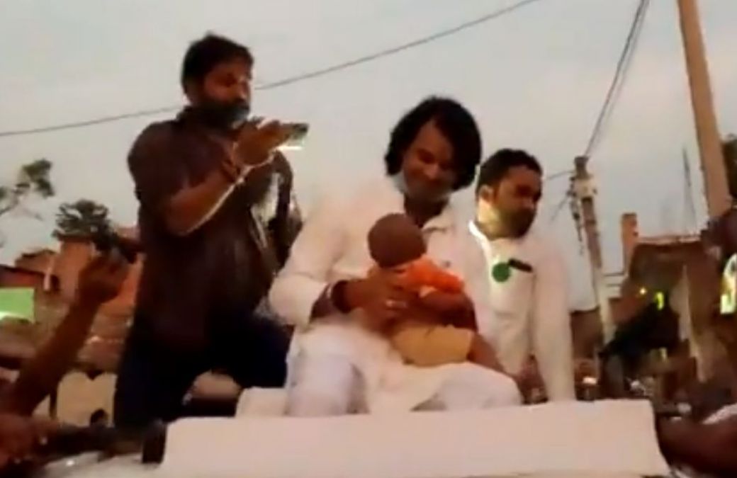 Bihar elections: Tejpratap Yadav seen campaigning with a child in his lap