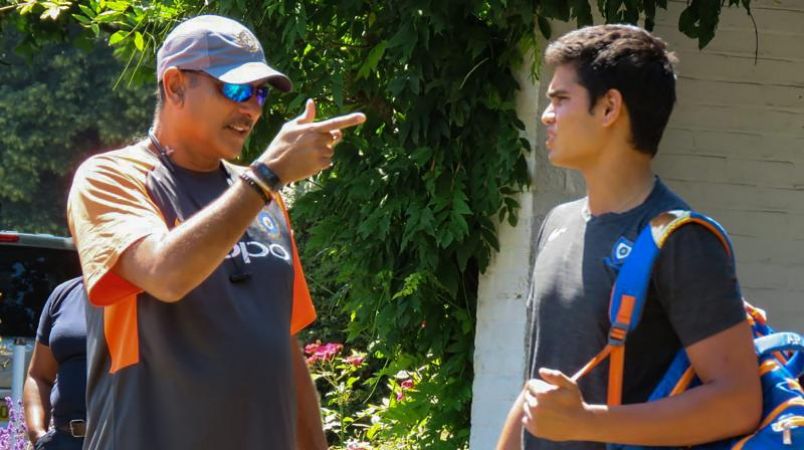 Arjun Tendulkar practices with the Indian team get a tip from Shastri