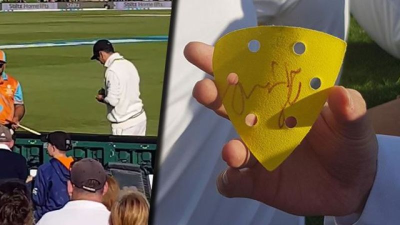 Ross Taylor signs on a sandpaper for fans