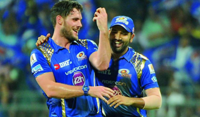 Rohit Sharma has a good time with his IPL teammate McClenaghan.