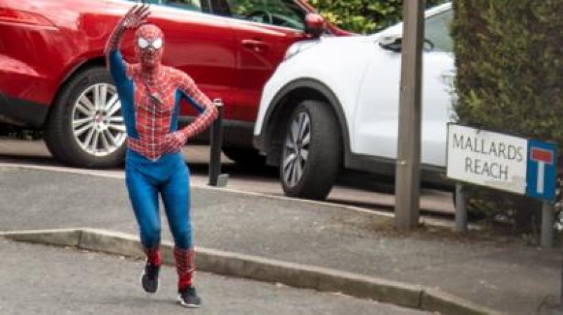 Spider-man helps neighbours with essential items