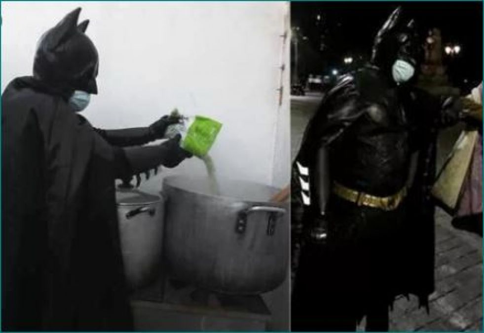 Person dressed like Batman helping poor and needy in Chile