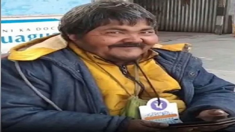 This beggar is very unique, begging by putting QR code around his neck