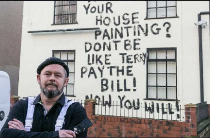 This painter angrily writes message on the wall of owner's house
