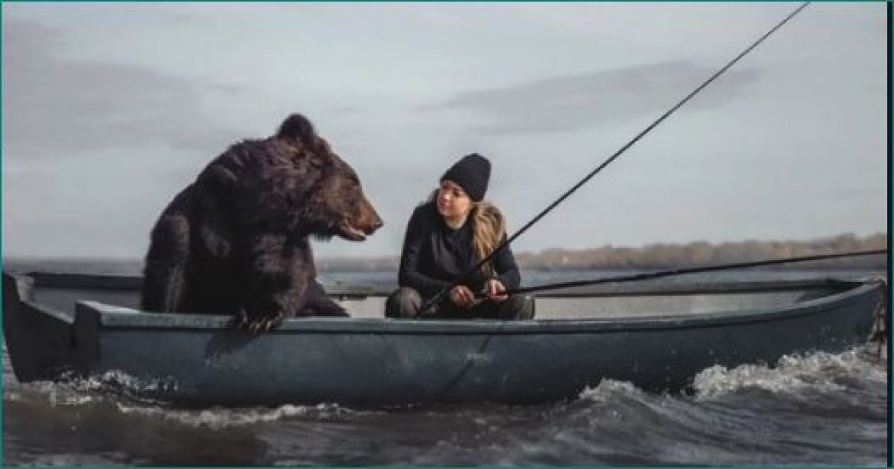 This girl has kept a sail bear, both of them were seen fishing on a boat