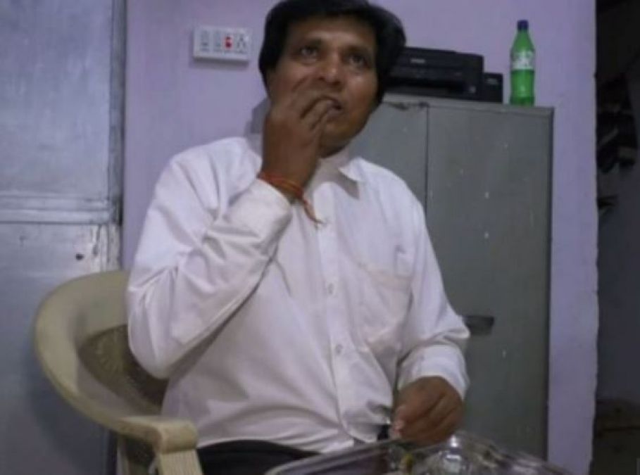 The man runs to eat glass as soon as he sees, such a strange hobby