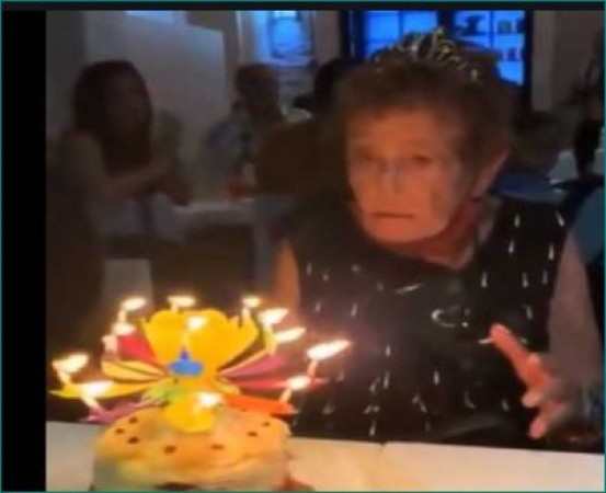Elderly woman's reaction at blooming musical flower candle, Video viral