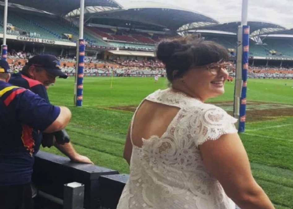 This woman loves her wedding dress very much, seen everywhere in this dress