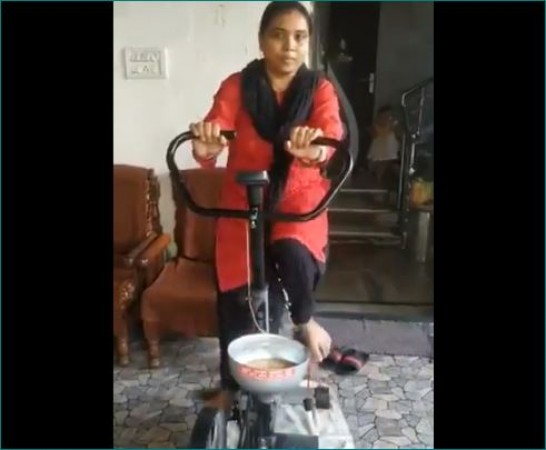 Woman exercising and grinding wheat simultaneously, video going viral